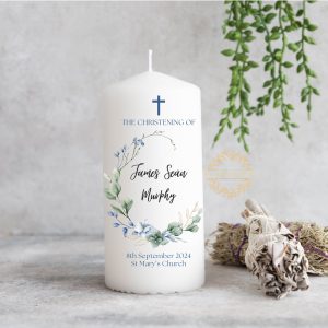 Personalized Christening candle with greenery and blue floral wreath design, featuring custom name, date, and church details, perfect for a baby boy’s baptism ceremony.