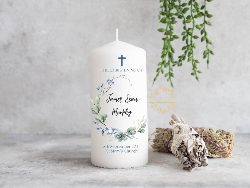 Personalized Christening candle with greenery and blue floral wreath design, featuring custom name, date, and church details, perfect for a baby boy’s baptism ceremony.